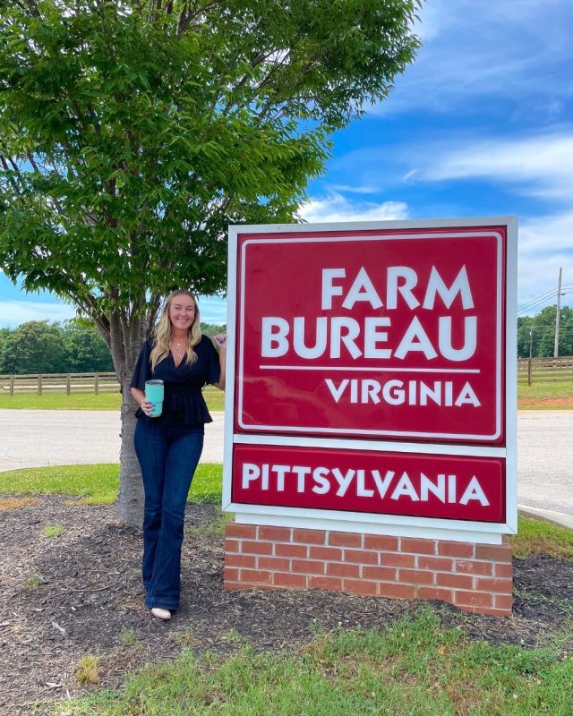 Anderson poses in front of the Farm Bureau of Virginia’s Pittsylvania sign where she conducted an audit this summer. Photo courtesy of the Farm Bureau of Virginia.