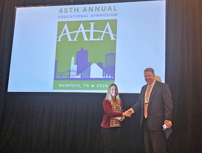 Jennifer Friedel receives the Excellence in Agricultural Law award from John Dillard, USDA Practice Head at Olsson Frank Weeda Terman Matz PC and a 2005 Department of Agricultural and Applied Economics alumnus. Photo courtesy of American Agricultural Law Association.