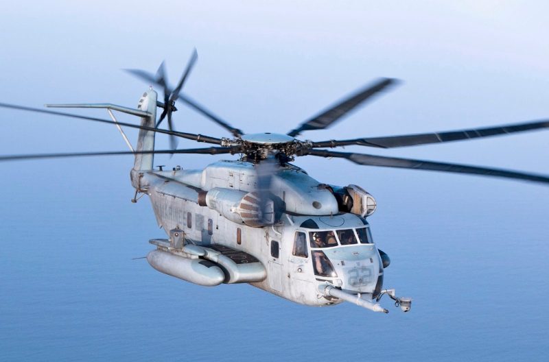 The Sikorsky CH-53E Super Stallion is a heavy-lift helicopter operated by the United States military. As the Sikorsky S-80, it was developed from the CH-53 Sea Stallion, mainly by adding a third engine, adding a seventh blade to the main rotor, and canting the tail rotor 20°. It was built by Sikorsky Aircraft for the United States Marine Corps. The less common MH-53E Sea Dragon fills the United States Navy's need for long-range minesweeping or airborne mine countermeasures missions, and performs heavy-lift duties for the Navy. The Sikorsky CH-53K King Stallion, which has new engines, new composite rotor blades, and a wider aircraft cabin, is set to replace the CH-53E. 