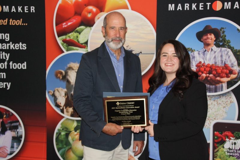 French Price (right), value chain coordinator for Virginia Cooperative Extension, accepts the Innovation Award on behalf of the Virginia MarketMaker Team.