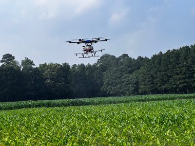A drone flies over a field